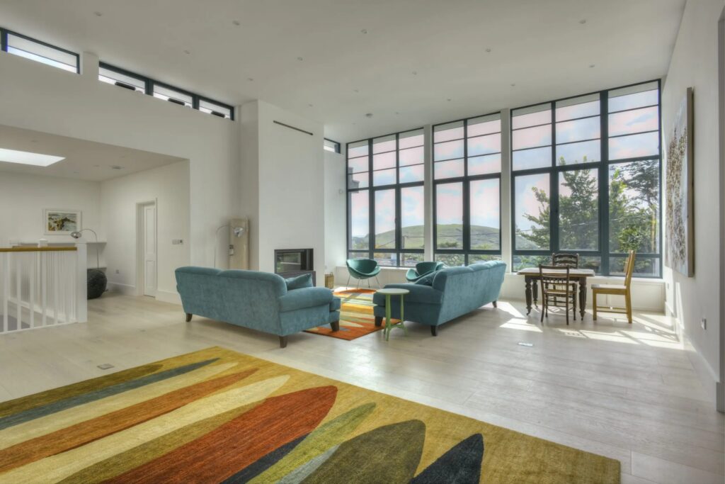 Living room with vista view through windows for coastal homes Sieger Systems 8256x5504 1 scaled