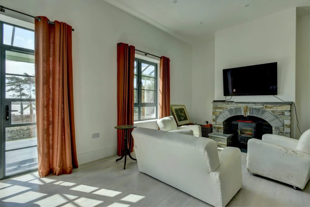 TV area with windows for coastal homes Sieger Systems 8256x5504 1 2048x1365.jpg
