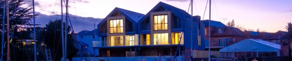banner 2 of the contemporary housing units using slim framed aluminium glazing systems from sieger