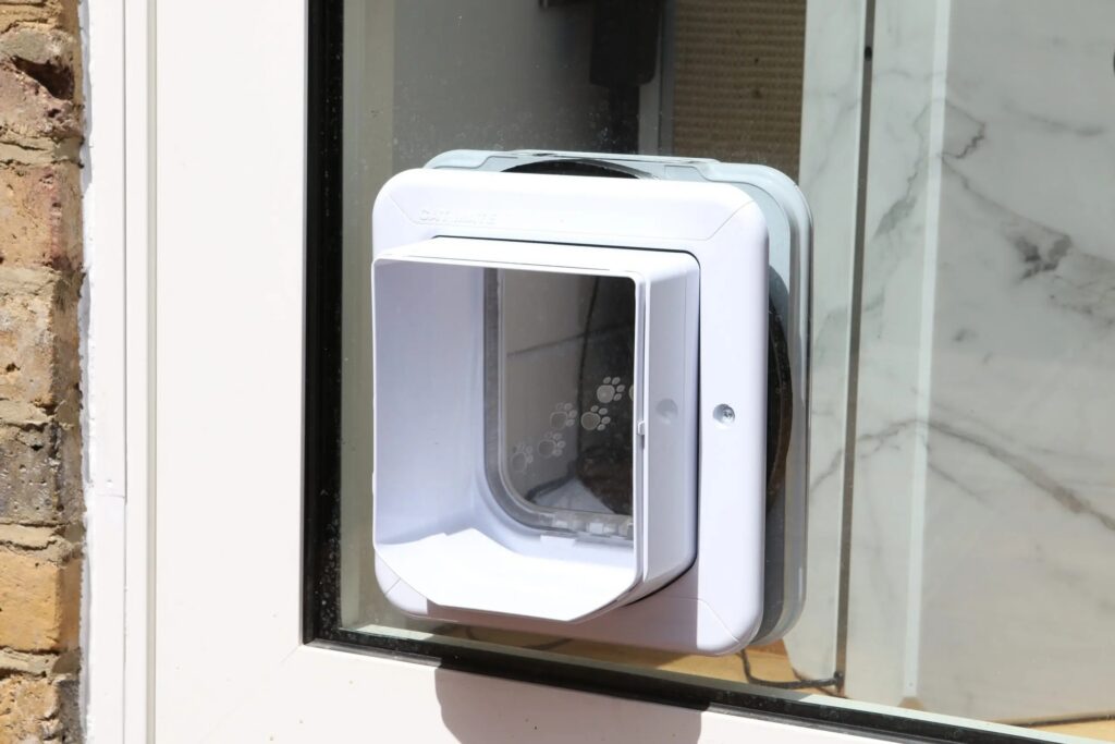 cat flap closeup Orchard Road sliding door with a cat flap Sieger Systems cr scaled