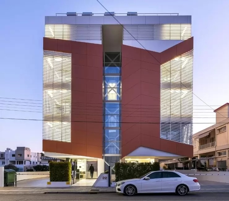 external view of a residential apartment block in Greece that uses Siegers slim framed aluminium sliding glass doors