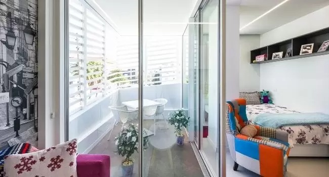 residential apartment in Greece with protected balcony and corner opening slim sliding doors .jpg
