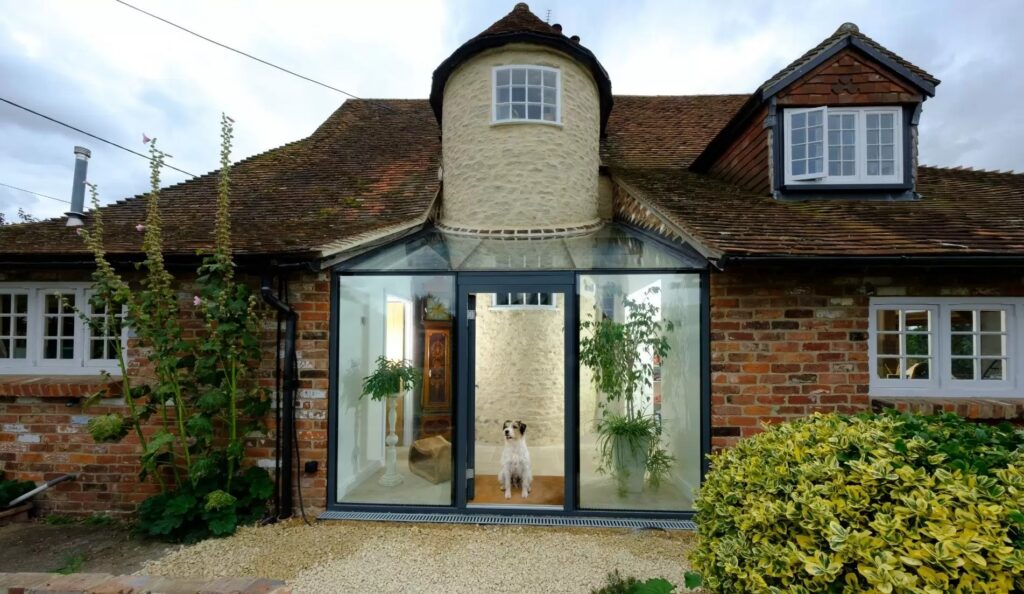 schuco casement door and fixed structural glazing used for a glass box entrance on a period property